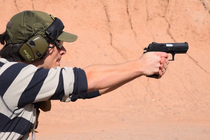 The author shooting a mid-sized polymer Jericho 941 in 9x19mm. Image by Colin Anthony.