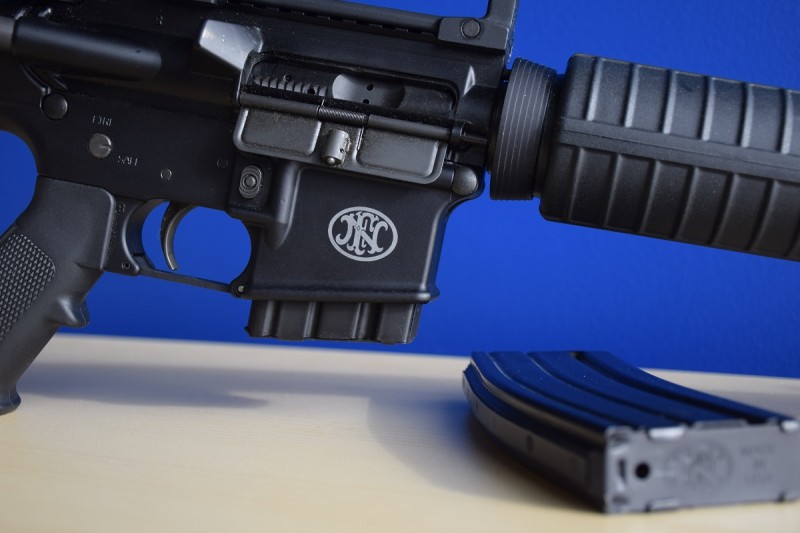 An FN rollmark is prominently displayed on the right side of the FN 15 Rifle's lower receiver.