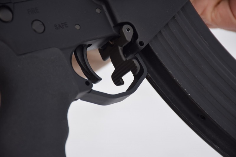 The LAR-47's magazine release is located inside the trigger guard.