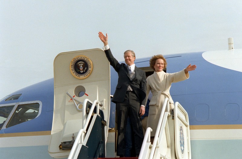 Former_President_and_First_Lady_Carter_wave_from_their_aircraft.jpeg