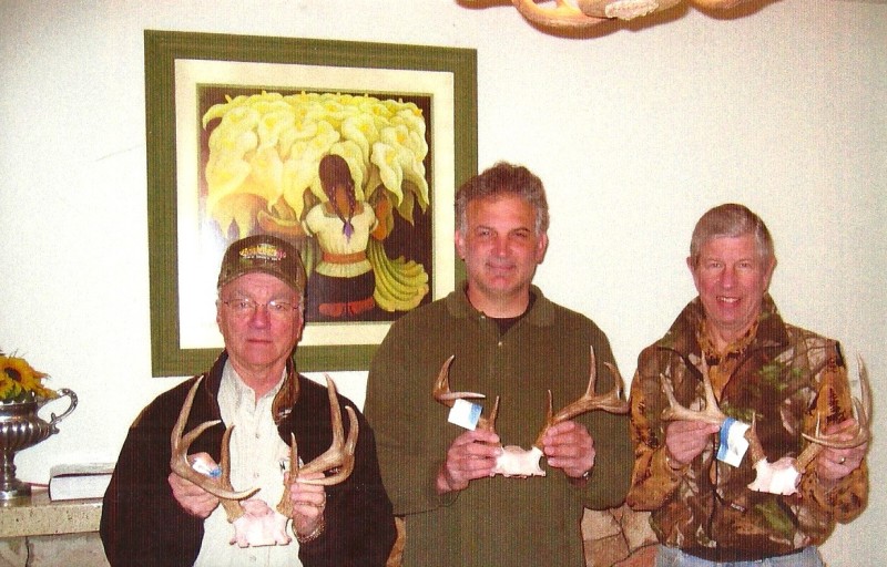 "Dr. Dave," Mark, and author with three Pope and Young archery bucks. Image courtesy Dennis Dunn.