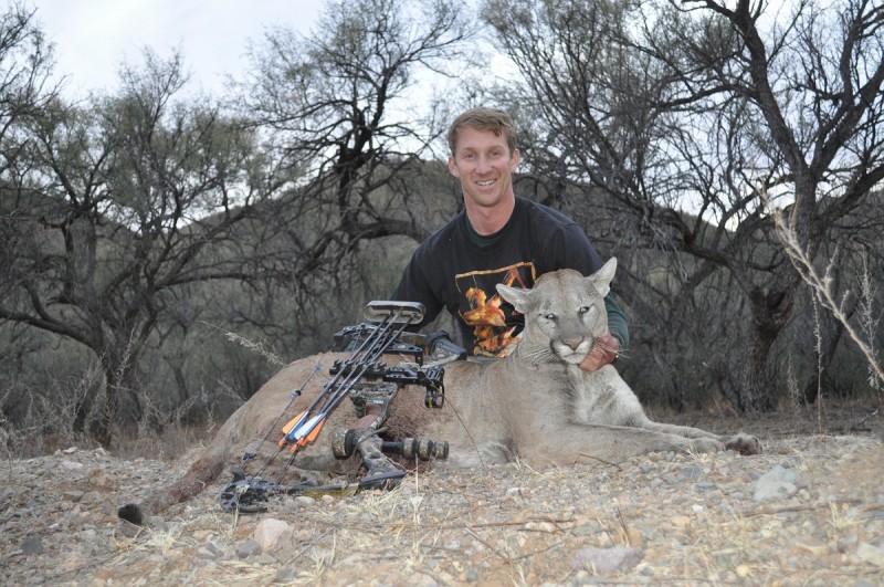 David with his mountain lion. His flechador shirt peeks out from behind the big cat. Image courtesy Dennis Dunn.