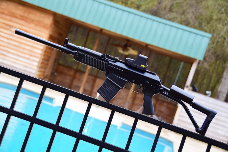 The Vepr has conventional AK-style furniture and a top-mounted Picatinny rail.