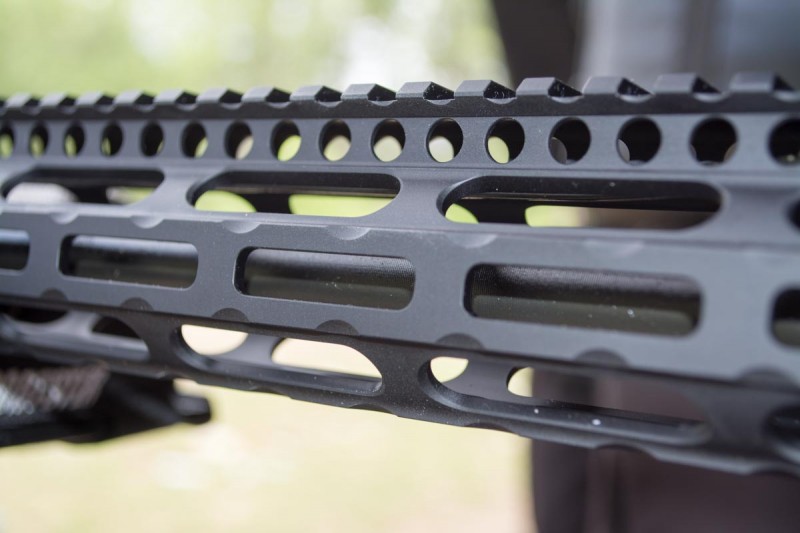 The rounded rectangular holes on the handguard are M-LOK attachment points.