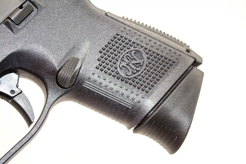The sides and rear of the grip are moderately textured, while the front surface is covered with light horizontal ridges.