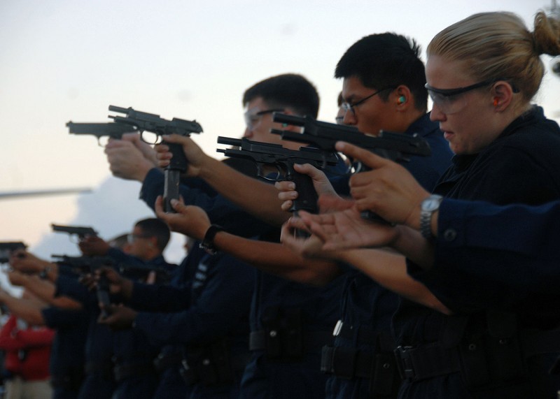 US Navy sailors practicing with the M9.