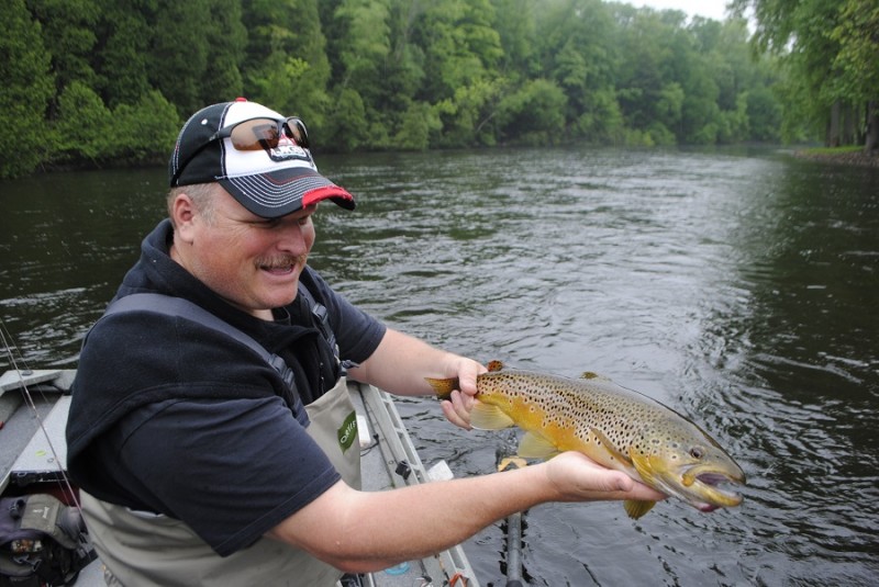 Denny Bouwens shows off a nice brown trout, taken on a Rapala.