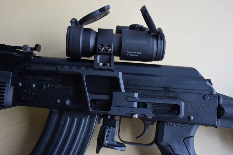 An RS Regulate AK-300 side mount attached to the rifle's side rail holding an Aimpoint PRO.