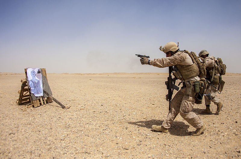 An US Marine fires the M1911 during an exercise in 2013.