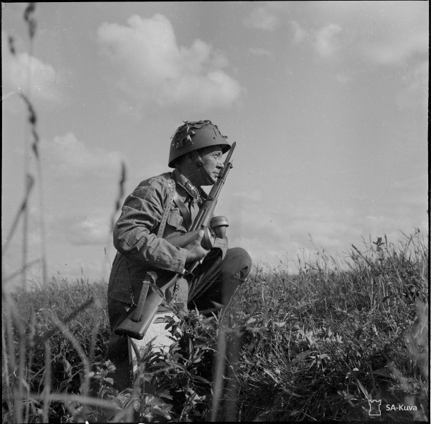 A Finnish soldier with a Carcano rifle. Date taken: August 1, 1941.