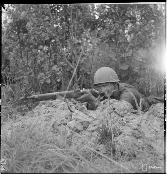 A soldier with a Finnish-modified Mosin-Nagant rifle during the Battle of Vuosalmi. Date taken: July 13, 1944.
