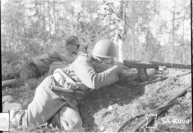 A Finnish soldier aims a captured Soviet-made SVT-38 rifle. 