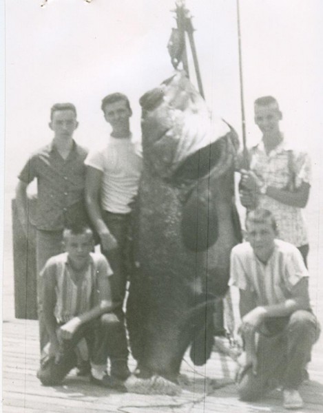 Lynn Johnson (top right) and his friends with this massive record grouper. 