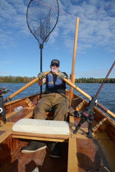 Tom Heberlein rows Patrick Durkin’s cedar-strip boat while trolling for muskies in Ashland County.
