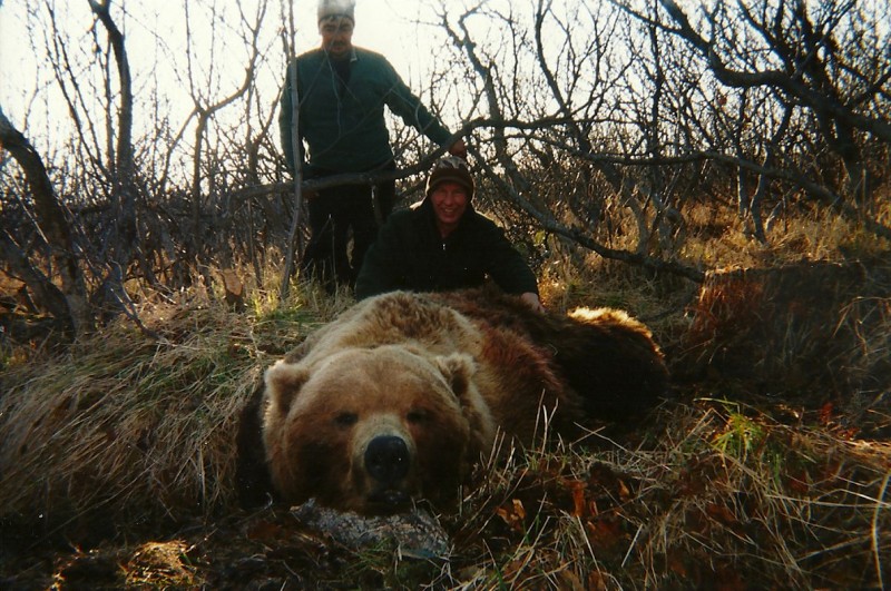 The author (foreground) and cook Paul Johnson with the massive bear.