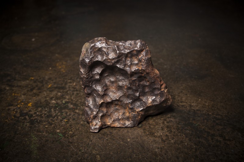A hunk of Gibeon meteorite that will go into making The Big Bang pistol set.