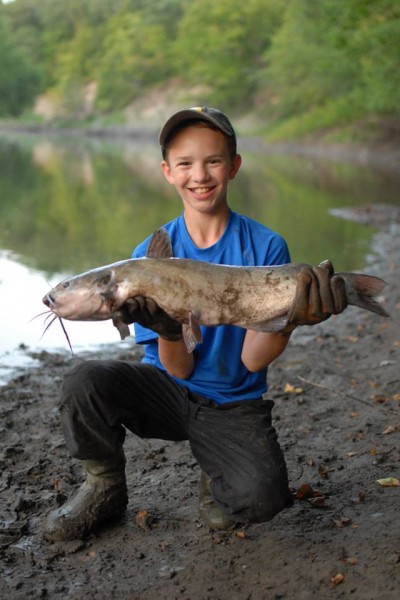 The author’s 13-year-old son, Elliott, loves to fish the riverbank for channel cats.