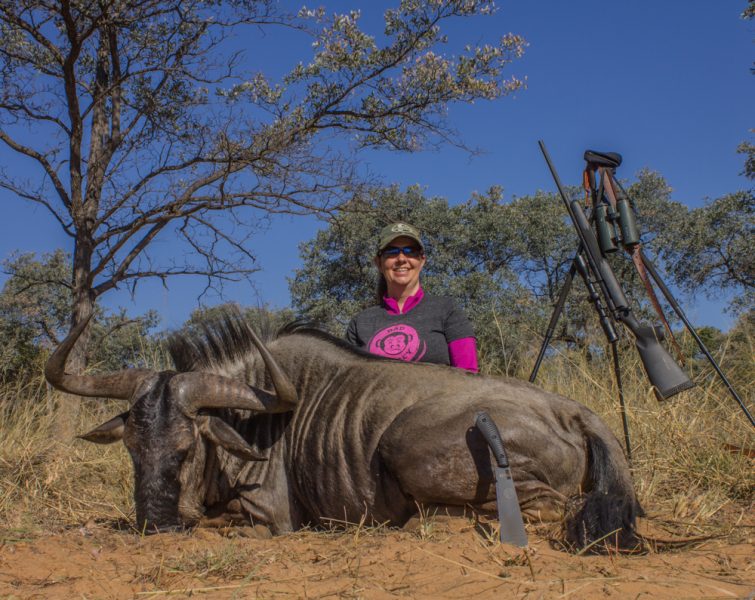 The author’s wife used a .243 Win. to take this monster wildebeest at 186 yards with one shot. Why do so many men think they need a bigger gun?