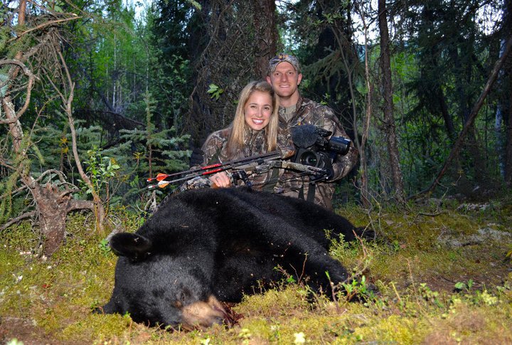 Ainsley with an Alaska black bear she arrowed in 2011.