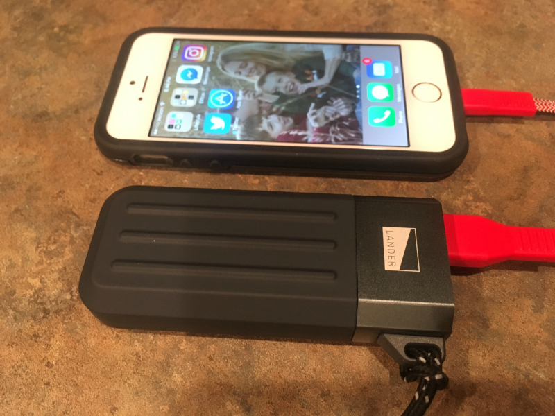 Lander portable chargers are compact; the 5200 is smaller than the author’s iPhone SE.