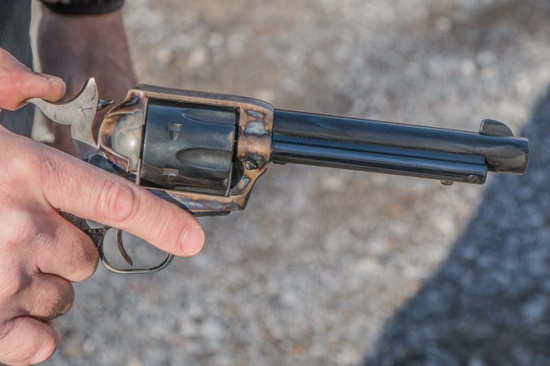 With minimal practice you can easily load a single action revolver and never take it out of your right hand. With Colt revolvers, start the process by retracting the hammer to half cock.