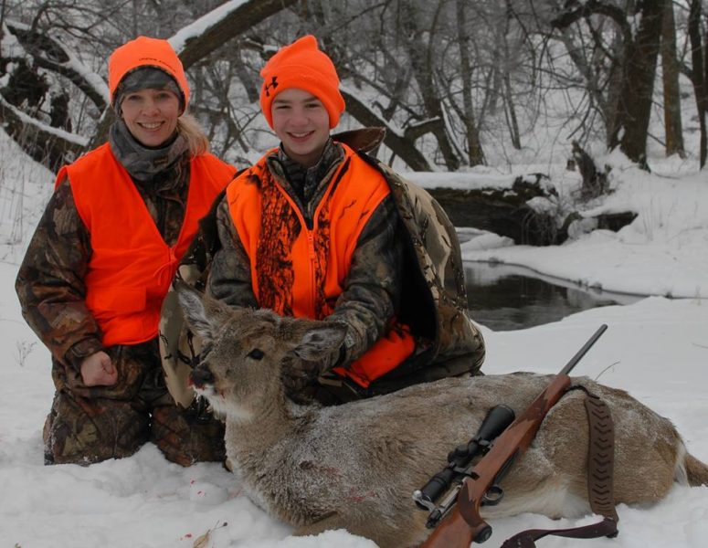 The author’s son, Elliott, and wife, Jodi, with the young hunter’s Christmas Eve whitetail.